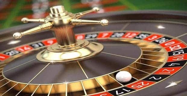 Filipino player accessing live casino table games on mobile phone with pgjl
